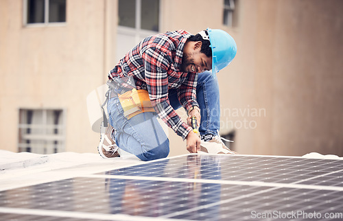 Image of Solar panel install, engineer and black man on roof, sustainable or renewable energy mockup. Photovoltaic technician, electricity and happy person check, maintenance or inspection with screwdriver.