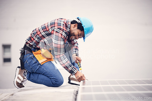 Image of Solar panel installation, engineer and black man on roof, sustainable or renewable energy mockup. Technician, photovoltaic electricity and happy person in maintenance or inspection with screwdriver.