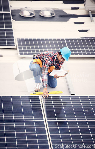 Image of Black man with clipboard, solar panels inspection and renewable energy, sustainable and eco friendly technology. Maintenance check, male engineer and infrastructure with electricity and top view