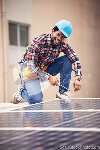 Image of Screwdriver, happy man portrait and solar panel installation of photovoltaic electricity cell on rooftop building. Sustainable, eco renewable energy and male handyman with sustainability plate tools