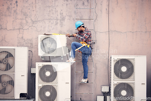 Image of Black man, ac repair and technician, maintenance with engineering and fixing air conditioner with tools. Handyman, service and manual labor with male electrician, technology and helmet for safety