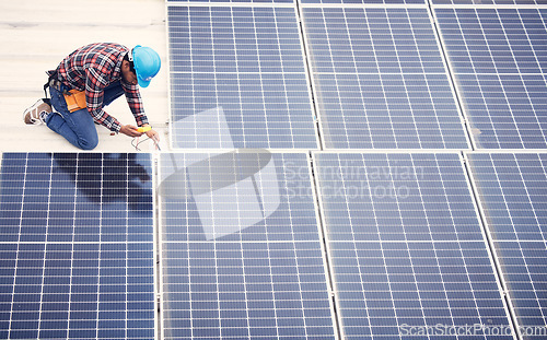 Image of Black man, solar panel installation and renewable energy, sustainability and eco friendly technology. Maintenance, male engineer and infrastructure, electricity and top view with energy saving