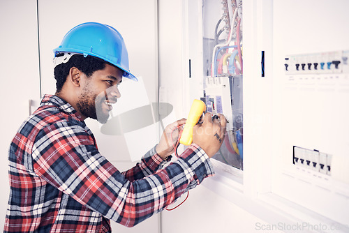 Image of Electrician multimeter, electric switch box and happy man check cable current, wire fuse or measure voltage power supply. Circuit maintenance inspection, African person and technician fix electricity