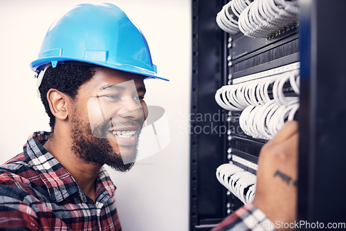 Image of Electrician, engineering and black man with circuit board for maintenance, inspection and repair. Construction, electricity and happy male worker, handyman and mechanic with system, cable and switch