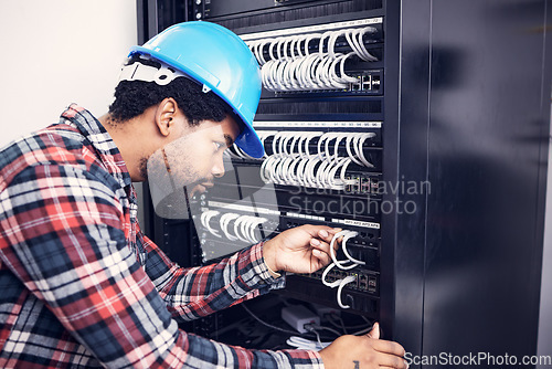 Image of Electrician, engineering and black man with circuit board for inspection, maintenance and repair. Construction, electricity and male worker, handyman and mechanic with system, cable server and switch