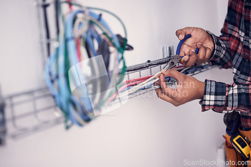 Image of Electrician, technician and hands of man with cable maintenance, inspection and home repair. Construction worker, electricity and male engineer, handyman and contractor with circuit, wires and tools