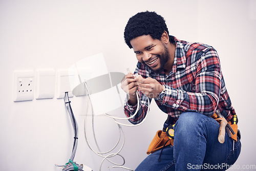 Image of Electric, industry and electrician working on a switchboard with cables for current, fuse or voltage. Electricity, power and African male industrial worker doing maintenance, repairs or fixing plugs.