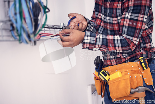 Image of Electrician, technician and man with tool for cable maintenance, inspection and home repair. Construction worker, electricity and male engineer, handyman and contractor with circuit, wires and belt