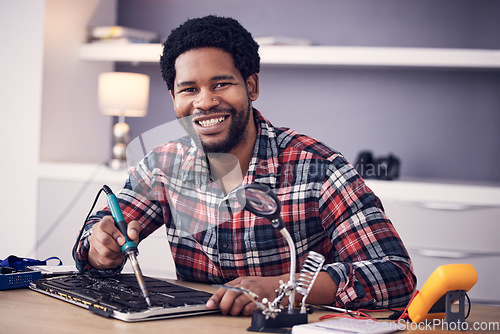 Image of Black man, technician fixing electronics and tablet hardware, soldering iron tools and tech repair. Maintenance, magnifying glass and electrical fix with happy male in portrait working on device