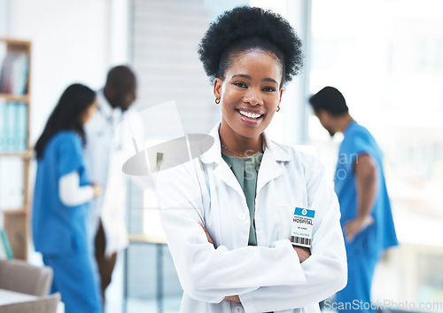 Image of Black woman, doctor leader and arms crossed in portrait at clinic for goals, excited and career vision. Female medic, leadership and management with confidence, success and happy for job at hospital