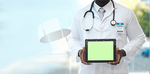 Image of Hands, tablet and green screen with doctor in hospital for promotion, mockup space and branding. Man, medic and tech touchscreen for telehealth mock up, app and logo in clinic for healthcare promo