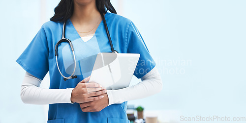 Image of Hands, tablet and doctor at hospital with space for promotion, mockup and wellness branding. Woman, medic and mobile touchscreen for telehealth mock up, service or consulting in clinic for healthcare