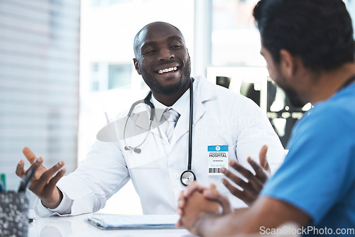 Image of Black man, doctor and nurse communication in a hospital with medical consultation. Healthcare, meeting and working wellness employee with smile in clinic talking about insurance and happy consulting