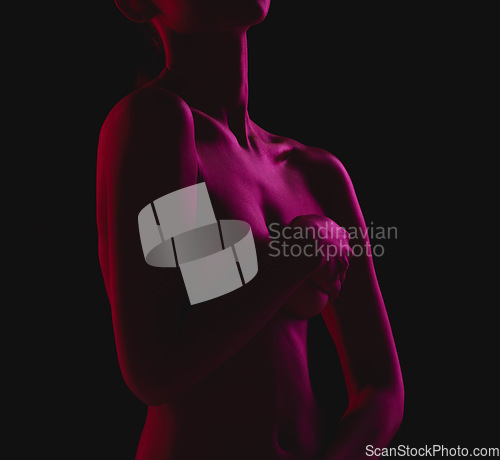 Image of Nude, sexy and naked woman body covering boobs feeling sensual isolated in a dark studio background for sexual desire. Seduction, art and skin by erotic female model with hands on breasts or chest