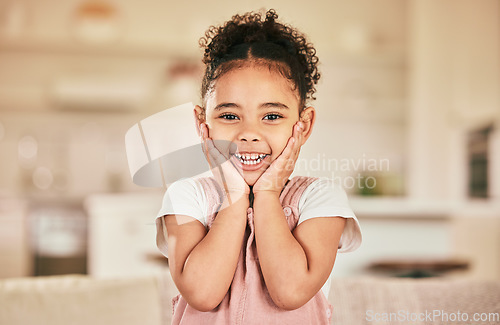 Image of Girl child, surprise smile and portrait in home living with happiness, youth and childhood. Happy female kid, excited and hands on face with wow in lounge, house or apartment with blurred background