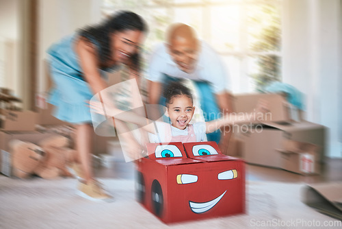 Image of Family, fun and motion blur with a girl in a toy car, being pushed by her mother and father in the living room. Children, excitement or love with a man, woman and daughter playing together at home