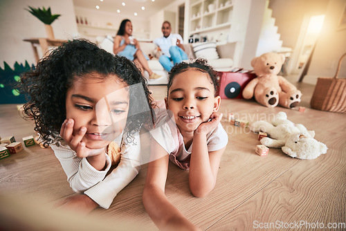 Image of Kids, sister and best friends on the living room floor together in their home for bonding while having fun. Children, family and smile with happy girls in their house for growth or development