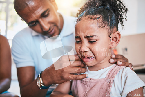 Image of Crying, child and dad support with love and parent care in a family home with a girl feeling sad. Upset kid, father and youth grief of a young daughter with papa and emotions from worry and stress