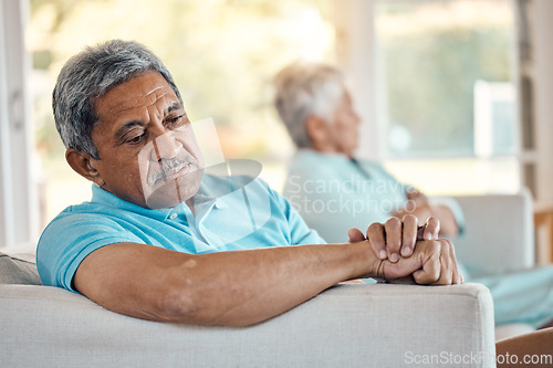 Image of Angry, senior couple and fighting on a sofa about divorce, breakup and separation in their home. Argue, depression and toxic elderly man with woman on couch after conflict, crisis or marriage problem