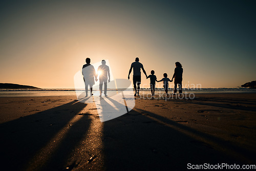 Image of Silhouette, beach and big family holding hands in sunset on a holiday or vacation at sea or ocean together. Travel, love or shadow of people at sunrise in support, freedom and bonding by water mockup