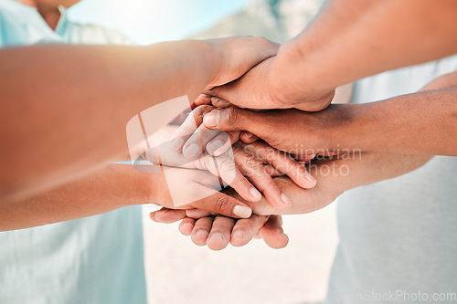 Image of People, trust and hands together for teamwork, agreement or collaboration in solidarity outdoors. Community, group or gathering piling or touching hand for unity, celebration or love in partnership