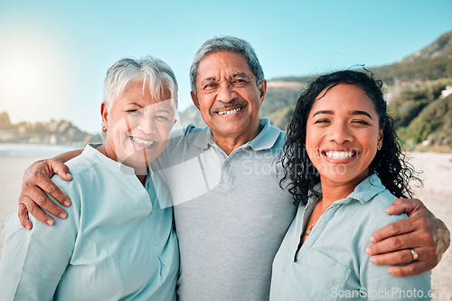 Image of Senior parents, daughter and smile on beach, hug and happiness in summer vacation together outdoors. Portrait of happy women, man and excited face hugging and smiling on family holiday at the ocean