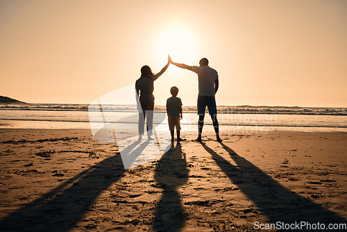 Image of Family silhouette at beach, protection and sunset with people, safety and security with parents and child outdoor. Mother, father and kid in nature, back and ocean view with love, care and support