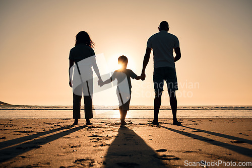 Image of Family silhouette at the beach, holding hands at sunset and people with love, care and support outdoor. Mom, dad and kid travel, back and ocean view with parents and children outdoor in nature