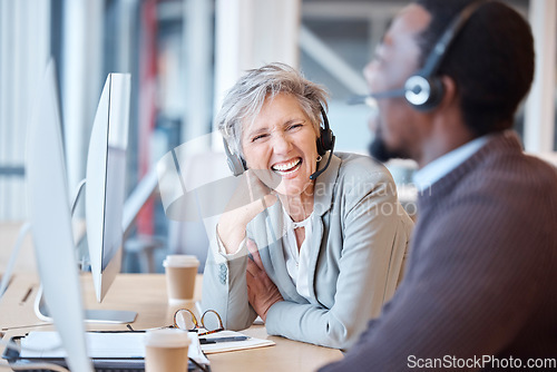 Image of Call center, laughing and happy people in office for working, customer support or consulting. Telemarketing, contact us and senior woman, friends and black man laugh at funny joke, comedy and humor.