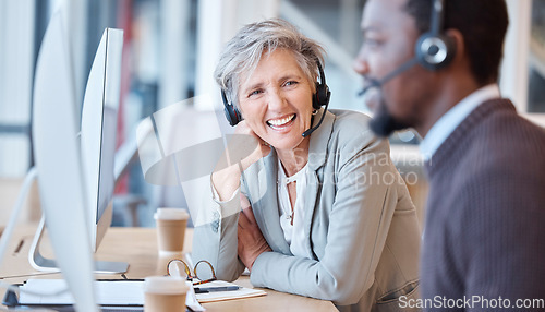 Image of Call center, team talking and laughing woman in office with coworker, funny joke or comedy. Telemarketing, contact us and happy elderly person, friends and black man laugh at customer service humour
