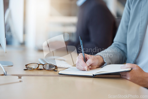 Image of Woman, hands and writing in book for business tasks, reminder or schedule at the office desk. Hand of female taking notes in diary for project planning, record keeping or information at the workplace