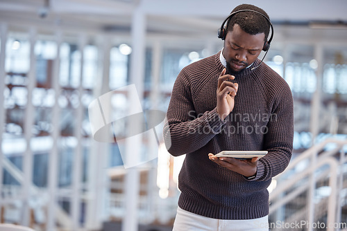 Image of Call center, tablet and confused black man in office for working, customer support or service. Telemarketing, thinking and technology of serious African person looking for solution or problem solving