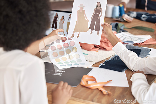 Image of Fashion, designer sketch and team collaboration on project, illustration or paper at a desk in office. Creative women, hands and teamwork on planning, discussion and drawing a design for clothes idea