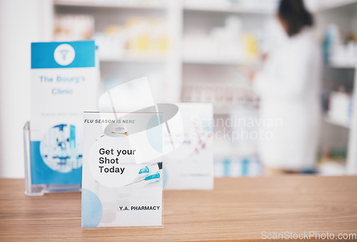 Image of Flu vaccine, sign and pharmacy poster in a medical shop and clinic for healthcare. Wellness, doctor and covid booster shot advertising placard showing health message for customer on a paper billboard