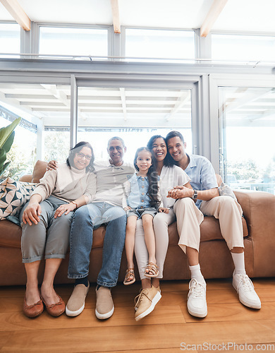 Image of Big family in portrait with parents, grandparents and child on sofa in new house, happiness and quality time. Happy people, women and men with kid on sofa to celebrate property investment with smile.