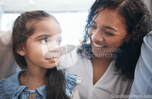 Image of Love, laughing and mother with child in a living room, talking and excited while bonding in their home. Funny, family and girl with parent in a lounge with joke, humor and silly conversation together