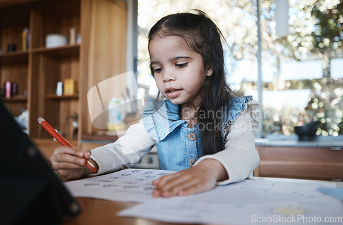 Image of Learning, education and girl writing in at a kitchen table for homework, drawing and home school activity. Education, student and kid with paper for sketch, art and lesson for child development