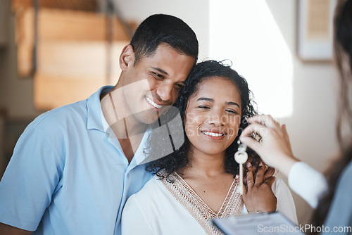 Image of Keys. realtor and a home owner couple in their new house after payment or investment in a property asset. Real estate, mortgage or loan with a man and woman receiving the key to their new house
