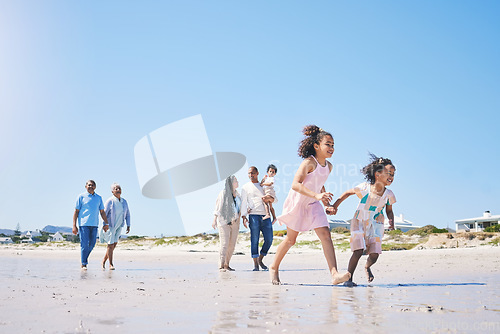 Image of Family, beach and children running with space for mockup in summer for adventure, love and travel together. Men, women and girl kids by ocean with parents, grandparents and mock up with blue sky