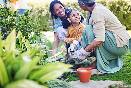 Image of A woman, mother and daughter gardening together outdoor for growth or sustainability during spring. Plants, children and earth day with a family bonding in the garden for eco friendly landscaping