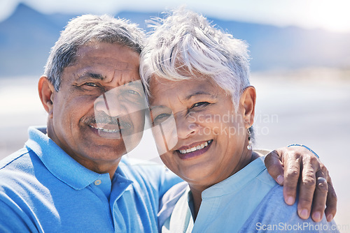 Image of Happy, senior couple and portrait at the beach for bonding, love and happiness in Costa Rica summer. Smile, hugging and face of an elderly man and woman by the sea for holiday, retirement and peace