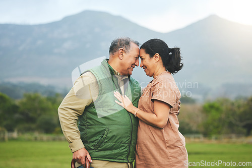 Image of Senior couple, love and outdoor in nature with care, support and commitment to happy partner. Elderly man and a woman on a grass field or countryside for travel, adventure and retirement vacation