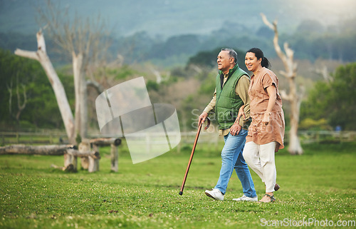 Image of Senior couple, walking and outdoor in nature with love, support and commitment to happy partner. Elderly man and a woman on a grass field or countryside for travel, adventure and retirement vacation