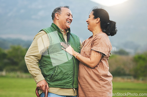 Image of Nature, laughing and senior couple outdoor in with love, care and commitment to happy partner. Elderly man and a woman on a grass field or countryside for travel, adventure and retirement vacation