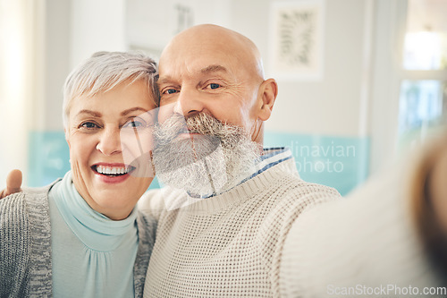 Image of Selfie, love and a senior couple in their home together, posing for a social media profile picture together. Photograph, portrait or face with an elderly man and woman posting a status update online