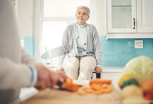 Image of Cooking, food and a senior couple in the kitchen of their home together during retirement for meal preparation. Health, wellness or nutrition with a mature man and woman making supper in their house