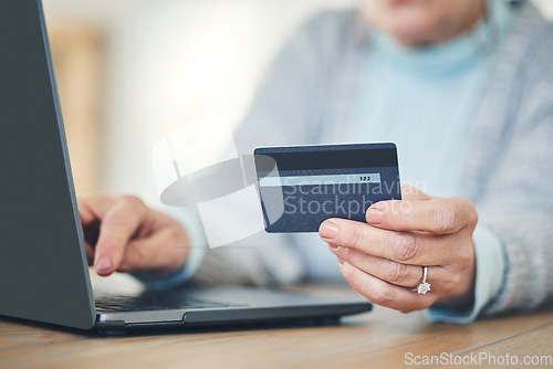 Image of Laptop, credit card and hands typing for online shopping, digital banking or payment in home. Computer, ecommerce and woman on internet for sales, finance or fintech purchase, savings or investment.