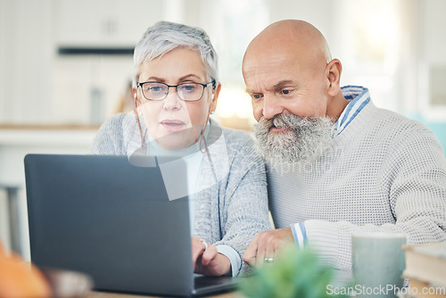 Image of Laptop, senior couple and typing in home, internet browsing or social media in house. Computer, retirement and man and woman reading email, news or streaming video, movie or film together online.