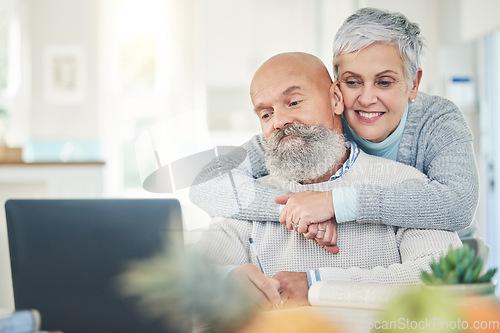 Image of Laptop, elderly couple and hug in home, internet browsing or social media in house. Computer, retirement and happy man and woman embrace while reading email, news or streaming video together online.