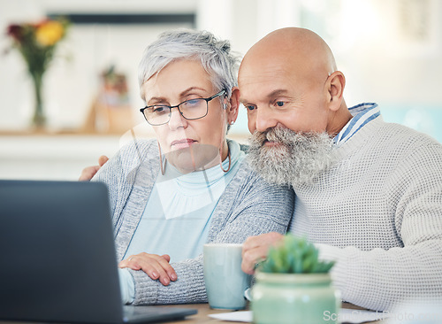 Image of Laptop, senior couple and video call in home, internet browsing or social network in house. Computer, retirement and serious man and woman in virtual conference, online chat or communication together